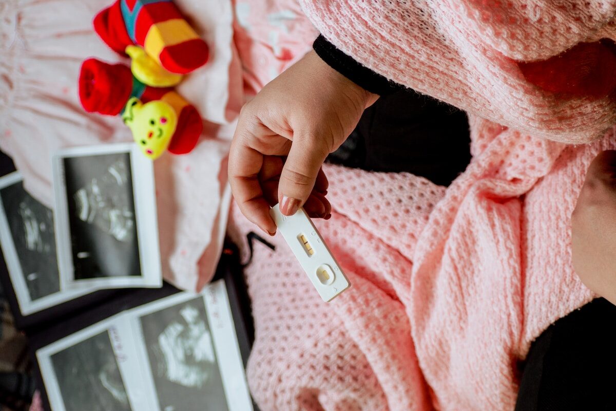 a person holding a baby's name tag in their hand