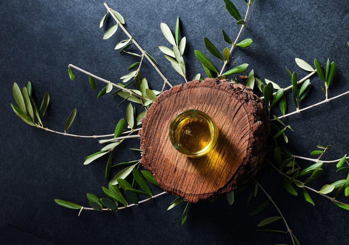 brown round wooden ornament on green leaves