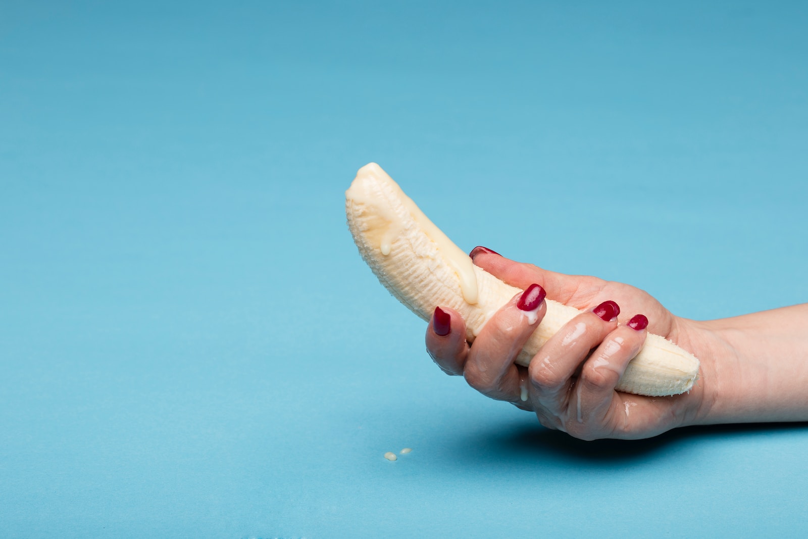 person holding brown wooden fish